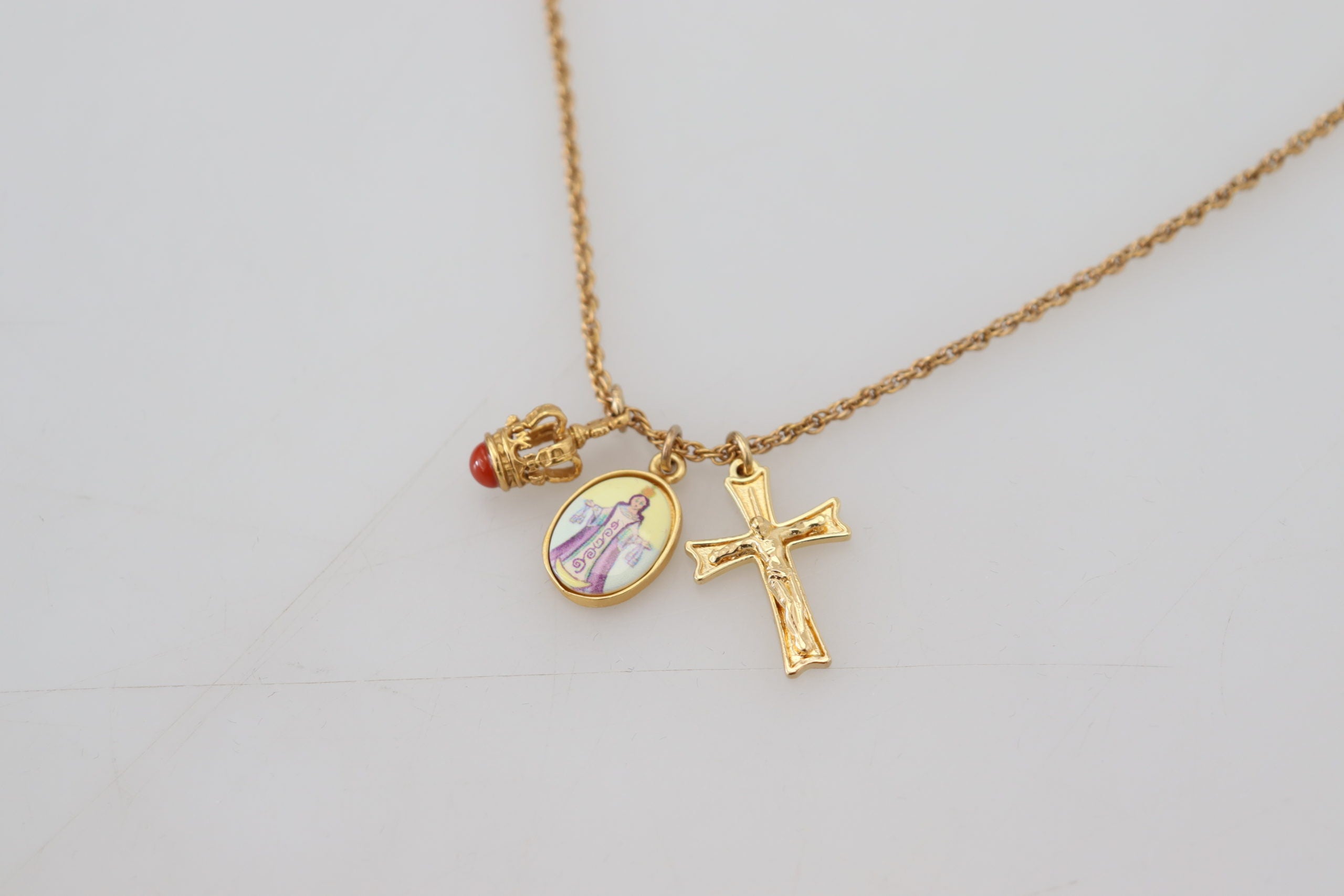 Dolce & Gabbana Elegant Gold Tone Charm Necklace with Cross Pendant